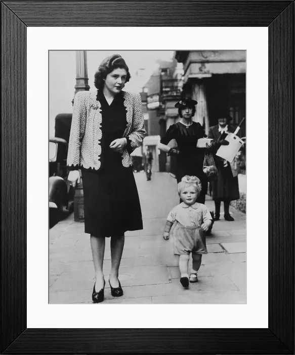 Framed Print : Mrs. Randolph Churchill (left) walking on a London street with her 20-month old son, Winston Churchill, grandson of Prime Minister Winston Churchill Framed Print : Mrs. Randolph Churchill (left) walking on a London street with her 20-month old son, Winston Churchill, grandson of Prime Minister Winston Churchill