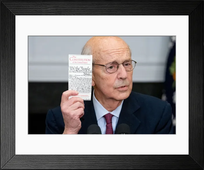 Framed Print : Supreme Court Justice Stephen Breyer holds a copy of the US Constitution as he speaks on his announcement of retirement, Jan. 27, 2022 (BSLOC_2022_2_27)