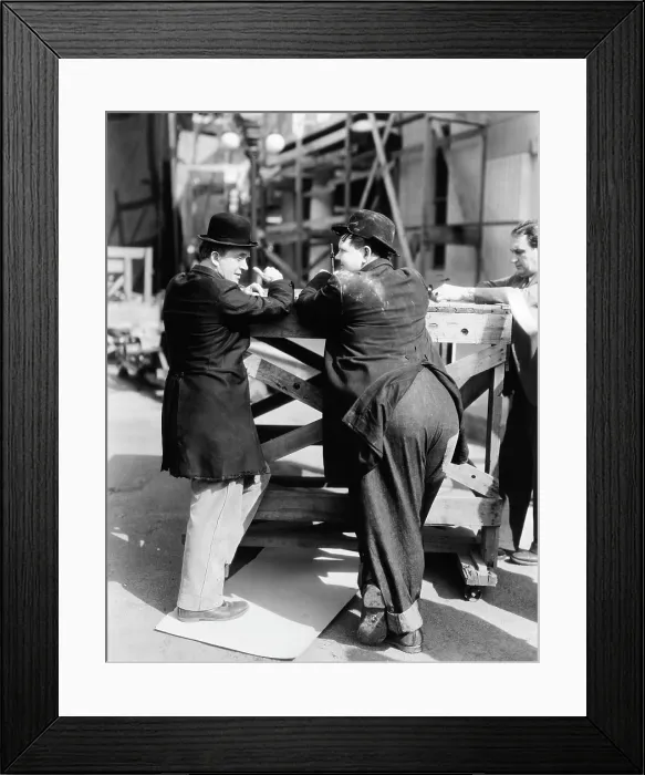 Framed Print : WAY OUT WEST, from left, Stan Laurel, Oliver Hardy, unit manager William Terhune, on location, 1937 Framed Print : WAY OUT WEST, from left, Stan Laurel, Oliver Hardy, unit manager William Terhune, on location, 1937