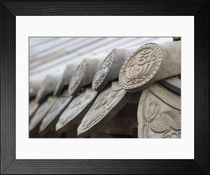 Framed Print : KOREA. Chiin-Ri. Haeinsa Temple. The Lotus flower (symbol of enlightenment) and the Om (symbol of the Unity with the Supreme Being) on the tiles of the monastery. Architecture Framed Print : KOREA. Chiin-Ri. Haeinsa Temple. The Lotus flower (symbol of enlightenment) and the Om (symbol of the Unity with the Supreme Being) on the tiles of the monastery. Architecture