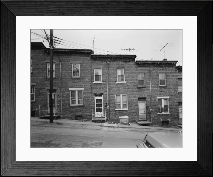 Framed Print : Yonkers, New York, ca. 1980. Moquette Row Housing was built between 1886 and 1889. Each bonds to its neighbors in a continuous row along the hill slope Framed Print : Yonkers, New York, ca. 1980. Moquette Row Housing was built between 1886 and 1889. Each bonds to its neighbors in a continuous row along the hill slope