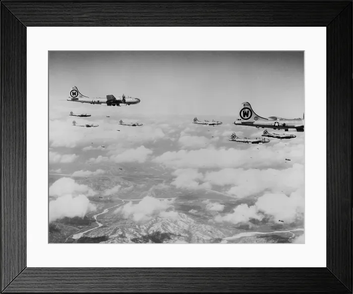 Framed Print : B-29s formation is shown dropping bombs over enemy territory in Korea. At first North Korea's strategic targets and industries bombed by daylight