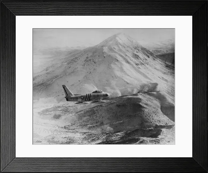 Framed Print : F-86 Sabre Jet against a rugged, snow covered mountain peak in North Korea. It was the most advanced U.S