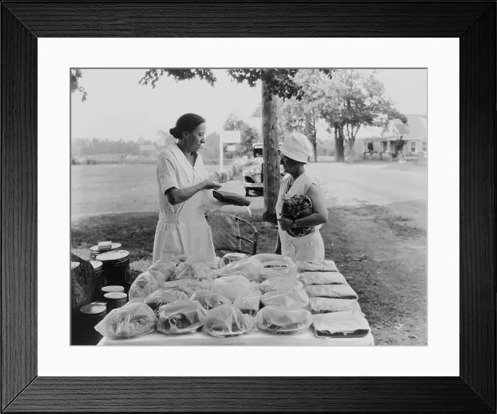 Framed Print : Rural woman selling baked goods by roadside, ca. 1925-30. The photo was created by the US Department of Agriculture, to propose ways farmers could increase their cash incomes