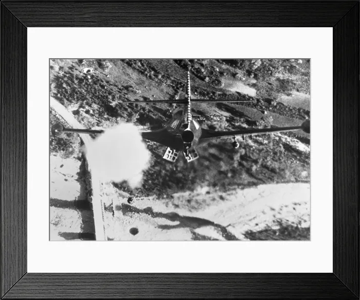 Framed Print : F-84 Thunderjet from the USS Bon Homme Richard, is shown rocketing and bombing Korean bridge. Nov. 11, 1952 during the Korean War. (BSLOC_2014_11_230)