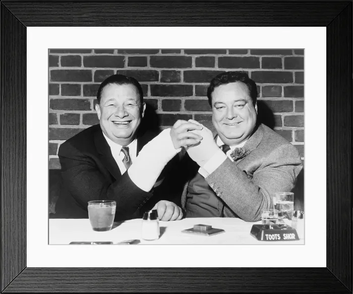 Framed Print : Toots Shor and actor Jackie Gleason holding up their broken hands while lunching at Toots Shors Restaurant, at 51 West 51st Street in 1963 Framed Print : Toots Shor and actor Jackie Gleason holding up their broken hands while lunching at Toots Shors Restaurant, at 51 West 51st Street in 1963