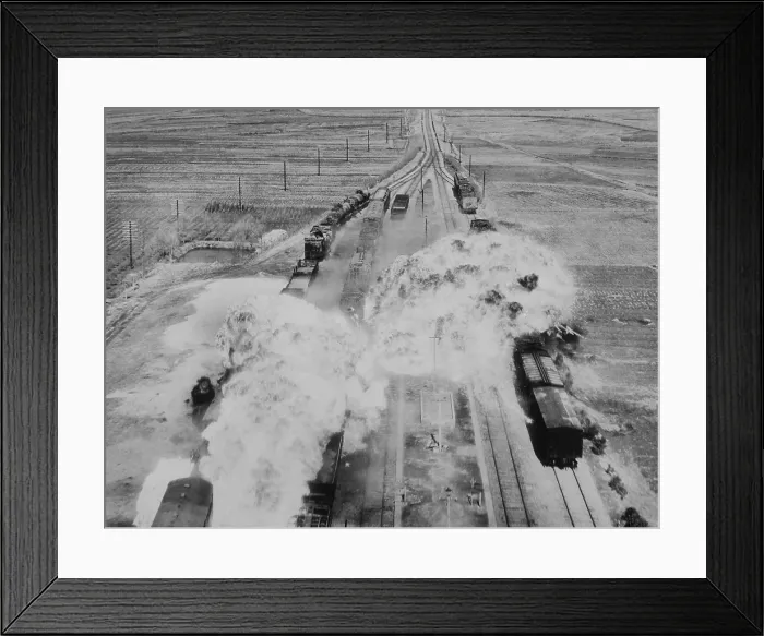 Framed Print : Two fireballs of napalm explode on North Korean railroad cars on the main rail line from Wonsan. Bombs of jellied gasoline were dropped from U.S