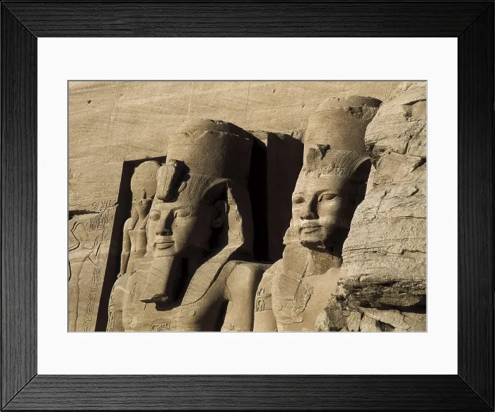 Framed Print : Great Temple of Rameses II. EGYPT. ASWAN. Abu Simbel. Great Temple of Rameses II. Upper section of two of the four colossus that flank the entrance to the Great Temple