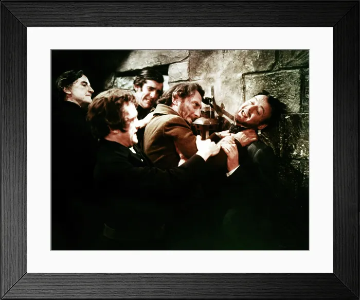 Framed Print : THE CURSE OF FRANKENSTEIN, Peter Cushing (hands on throat), Robert Urquhart (right), 1957