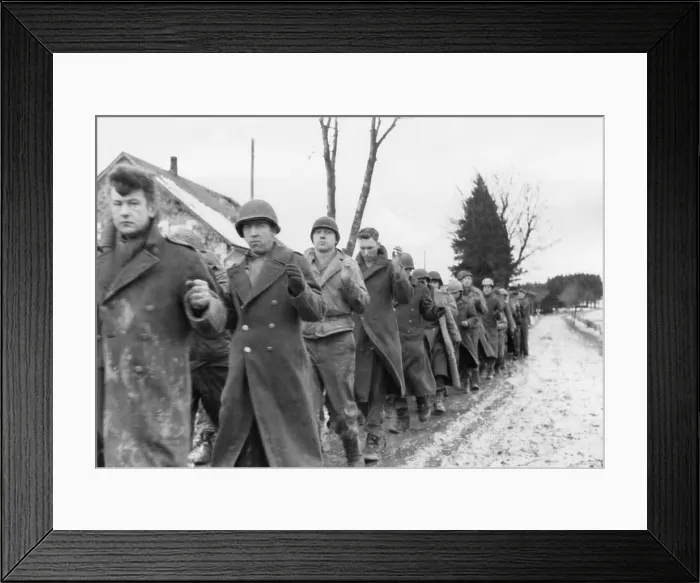 Framed Print : American prisoners of war are marched along a road during the Battle of the Bulge. Still from a captured German film. Ca. Dec. 10-17, 1944. World War 2. (BSLOC_2014_10_92) Framed Print : American prisoners of war are marched along a road during the Battle of the Bulge. Still from a captured German film. Ca. Dec. 10-17, 1944. World War 2. (BSLOC_2014_10_92)
