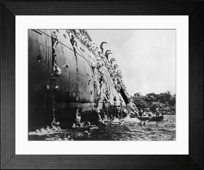 Framed Print : Soldiers abandoning the sinking SS President Coolidge in Espiritu Santo Harbor. She hit a U.S Framed Print : Soldiers abandoning the sinking SS President Coolidge in Espiritu Santo Harbor. She hit a U.S