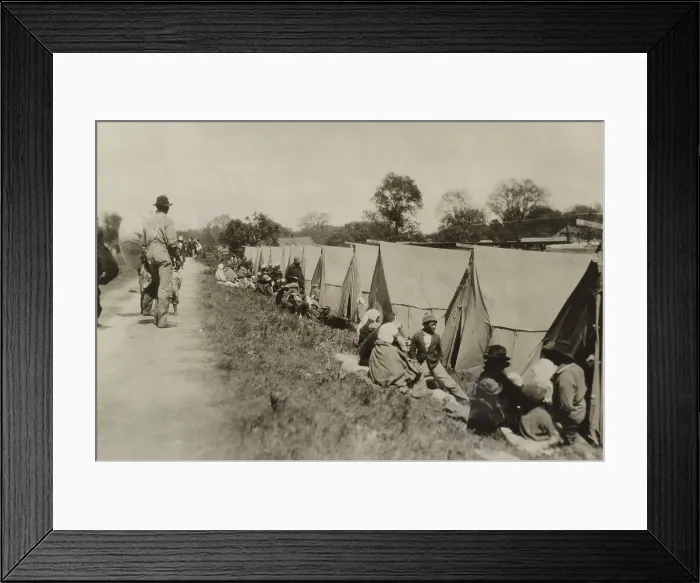 Framed Print : Levee at Greenville, Mississippi, where African Americans sit by tents on uneven ground. The tents were supplied by the American Red Cross