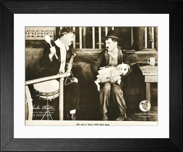 Framed Print : A DOG'S LIFE, right: Charlie Chaplin; dog on lap: Mut'; on lobbycard, 1918