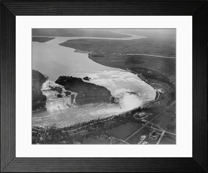 Framed Print : Aerial view of Niagara Falls, New York in 1922. The American side is on the left, the Canadian on the right