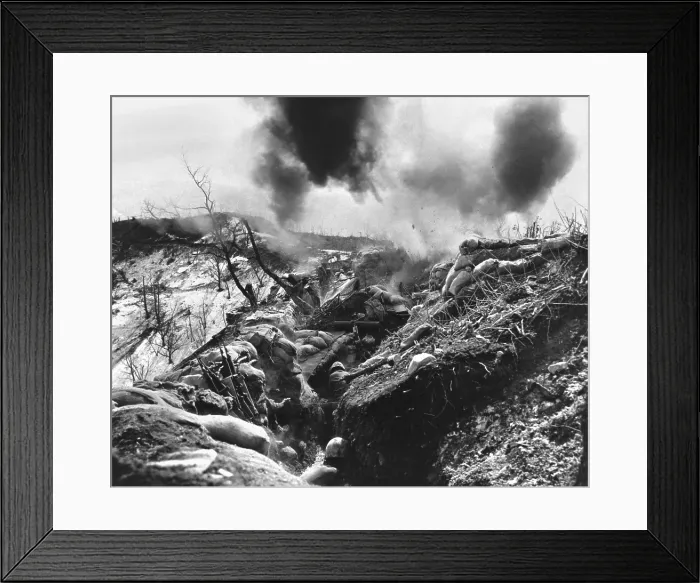 Framed Print : U.S. Marines take cover in a deep trench as Red mortar shell lands nearby. May 12, 1952
