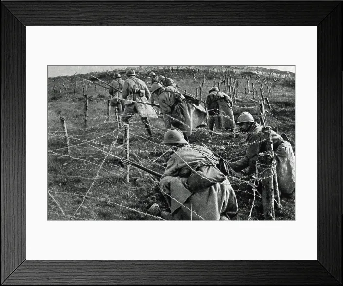 Framed Print : World War 1: Battle of Verdun. French soldiers crawling through their own barbed wire entanglements as they begin an attack on enemy trenches. April-June, 1916. (BSLOC_2013_1_100)