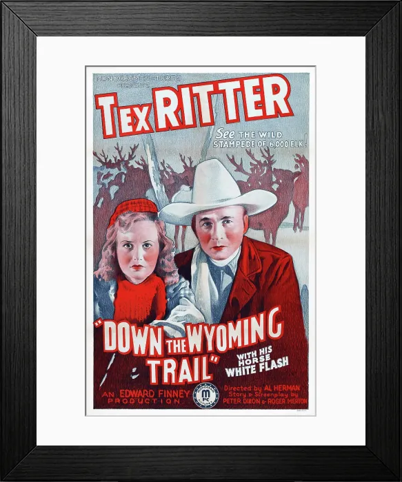 Framed Print : DOWN THE WYOMING TRAIL, l-r: Mary Brodel, Tex Ritter on poster art, 1939