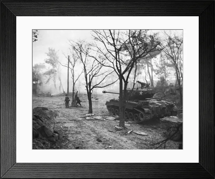 Framed Print : U.S. Marines, supported by one of their tanks, mop up heights on Wolmi Island