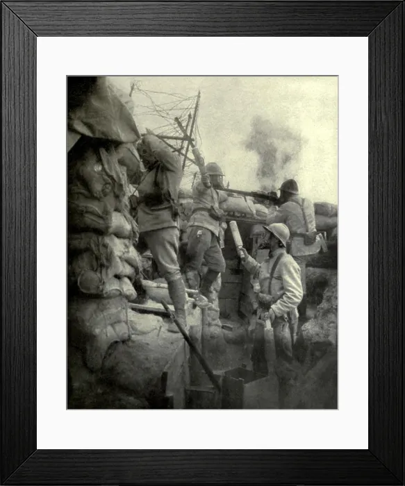 Framed Print : World War 1. Somme Offensive. Two French soldiers hurling bombs (grenades) over the trench parapet, while a third hands them up as required