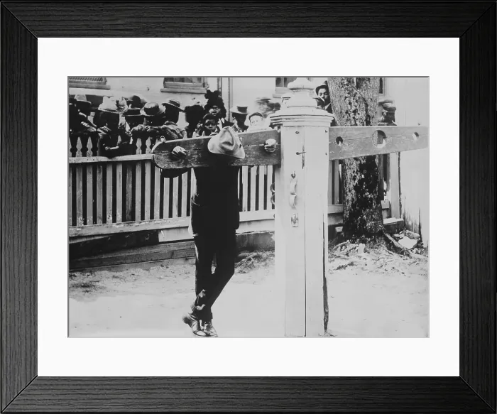 Framed Print : African American man with his neck and hands immobilized in punishment pillory, Delaware, c. 1900-1920 Framed Print : African American man with his neck and hands immobilized in punishment pillory, Delaware, c. 1900-1920