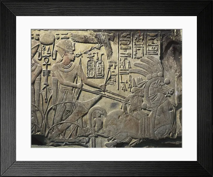 Framed Print : Stela of Amenhotep III. 1391 BC - 1353 BC. Amenhotep III in his war chariot. This stela was reutilized as building material. Egyptian art. New Kingdom. Relief on rock. EGYPT
