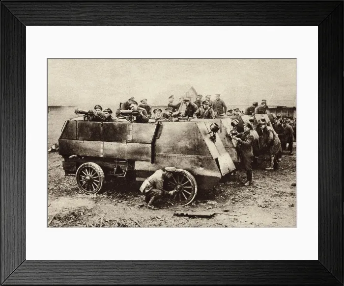 Framed Print : World War 1 Armored vehicles. Gunners and mechanics of the Canadian Motor Machine Detachment cleaning up their armored cars after a successful action on the Somme Front