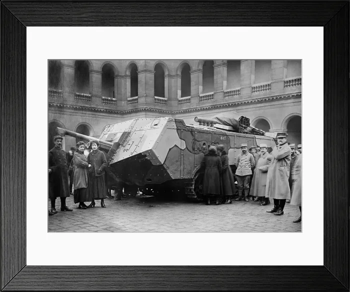Framed Print : World War 1 Tanks. Camouflaged French Saint-Chamond tank on display. It had a long body with a lot of the vehicle projecting forward of the short caterpillar tracks. Ca