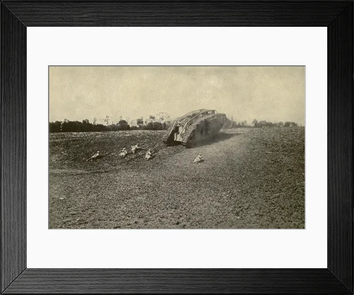 Framed Print : World War 1 Tanks. U.S. soldiers (107th Infantry, 27th Division) advancing toward the Hindenburg Line from behind the shelter of a British tank. 1918. (BSLOC_2013_1_155)