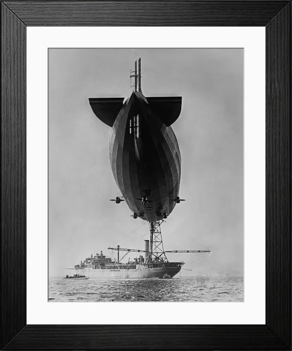 Framed Print : Sea level view of dirigible USS Shenandoah moored to her tender ship, the USS Patoka, 1924