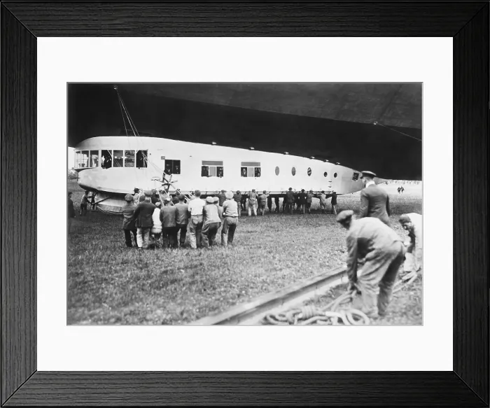 Framed Print : Cabin of the USS Los Angeles during her commissioning ceremony, on Nov. 25, 1924. VIP passengers are inside the gondola as ground crew handles the ropes Framed Print : Cabin of the USS Los Angeles during her commissioning ceremony, on Nov. 25, 1924. VIP passengers are inside the gondola as ground crew handles the ropes