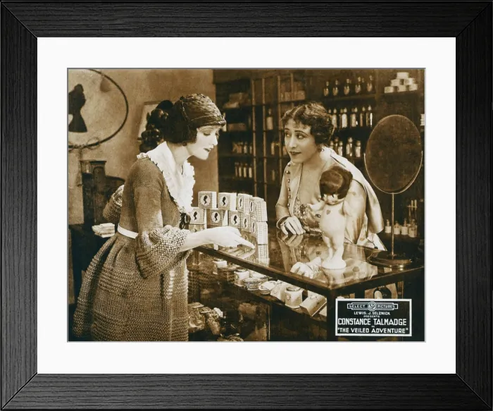 Framed Print : THE VEILED ADVENTURE, left: Constance Talmadge on lobbycard, 1919