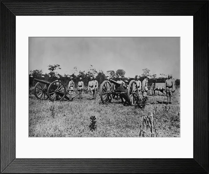 Framed Print : World War 1 in East Africa. German Askaris (native soldiers) posing at attention with artillery. Manning the gun on the left are two German officers. Ca. 1915-18 Framed Print : World War 1 in East Africa. German Askaris (native soldiers) posing at attention with artillery. Manning the gun on the left are two German officers. Ca. 1915-18