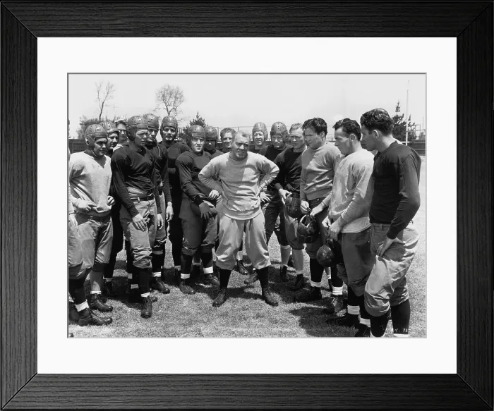 Framed Print : KNUTE ROCKNE ALL AMERICAN, center with hands on waist: Pat O'Brien, 1940