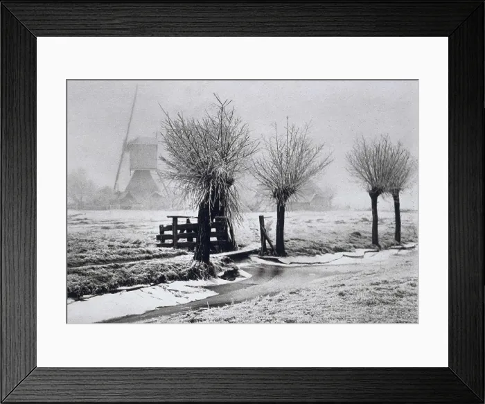 Framed Print : Misty Winterday, by Beers, J.G. 1904, photograph. Dutch foggy winter scene with windmill, pruned trees, snow and partially frozen canal (BSLOC_2016_2_1)