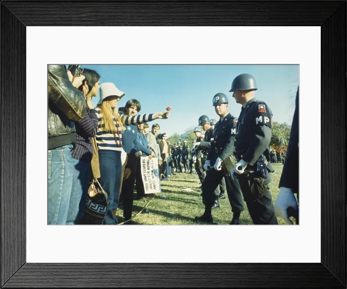 Framed Print : Female demonstrator offers a flower to military police during the 1967 March on the Pentagon Framed Print : Female demonstrator offers a flower to military police during the 1967 March on the Pentagon