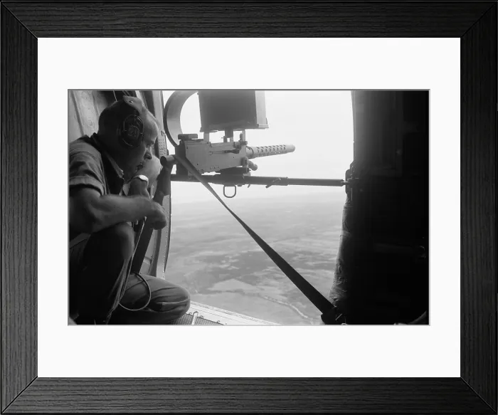 Framed Print : American door gunner scans the Vietnamese landscape from a helicopter. Mar. 25, 1962. Photo by Robert Pepper Martin. (BSLOC_2015_14_135) Framed Print : American door gunner scans the Vietnamese landscape from a helicopter. Mar. 25, 1962. Photo by Robert Pepper Martin. (BSLOC_2015_14_135)