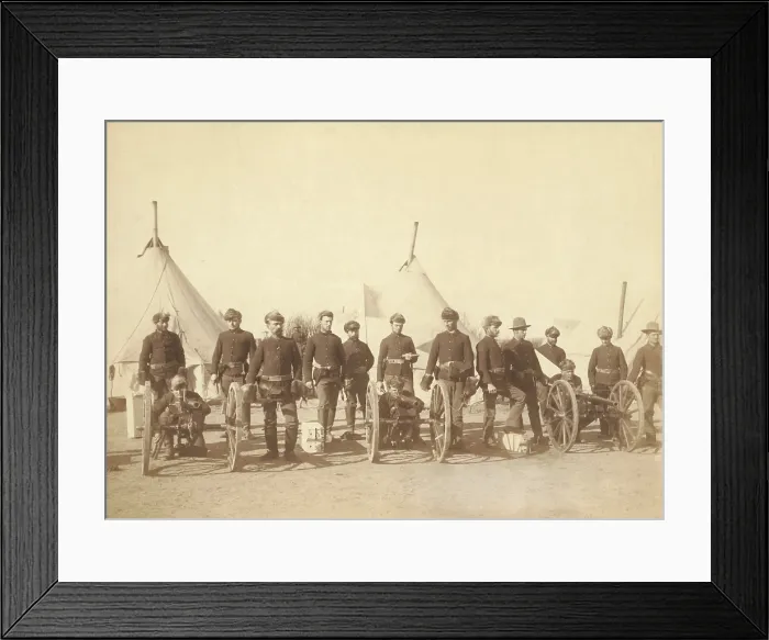 Framed Print : 15 men of Battery E, 1st Artillery, posed with three Hotchkiss guns in their encampment. The original caption of Jan