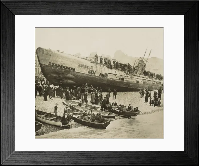 Framed Print : Curious civilians swarm over a stranded German U-boat on Englands south coast, 1918. In front of the conning tower is a cannon, which was lowered into the hull when submerged