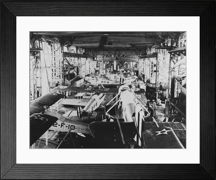 Framed Print : Aircraft in the USS Langleys hangar, during the 1920s. The larger plane in the foreground is a Douglas DT torpedo bomber, with its wings removed