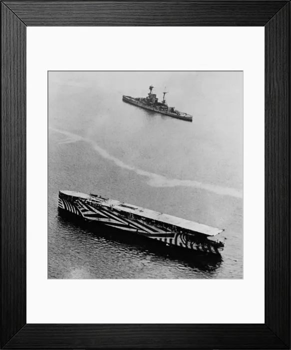 Framed Print : HMS Argus, World War 1 aircraft carrier painted in dazzle camouflage, 1918. She was the first true flat top designed as a launching platform for torpedo bombers