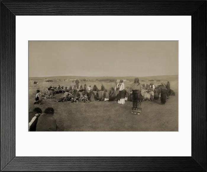 Framed Print : Native Americans performing ritual Ghost Dance c. 1890. One standing woman is wearing a white dress, a special costume for the ritual dance Framed Print : Native Americans performing ritual Ghost Dance c. 1890. One standing woman is wearing a white dress, a special costume for the ritual dance