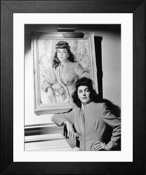 Framed Print : Maureen O'Sullivan standing beside her portrait, ca. 1941