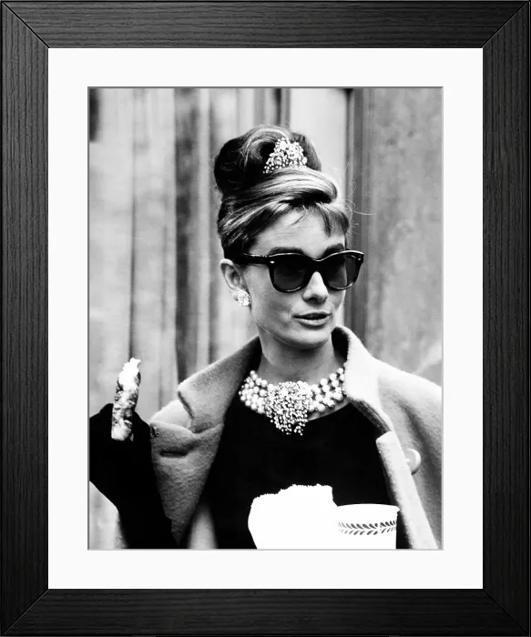 Framed Print : BREAKFAST AT TIFFANY'S, Audrey Hepburn eating between scenes on set, 1961 Framed Print : BREAKFAST AT TIFFANY'S, Audrey Hepburn eating between scenes on set, 1961