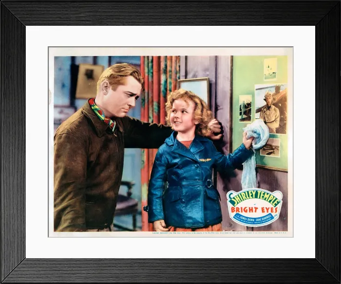 Framed Print : BRIGHT EYES, lobbycard, from left: James Dunn, Shirley Temple, 1934. TM and Copyright 20th Century Fox Film Corp. All rights reserved. / Courtesy Everett Collection