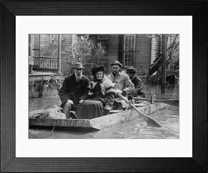 Framed Print : An elderly couple is evacuated from their Dayton home in a small wood boat in March 1913