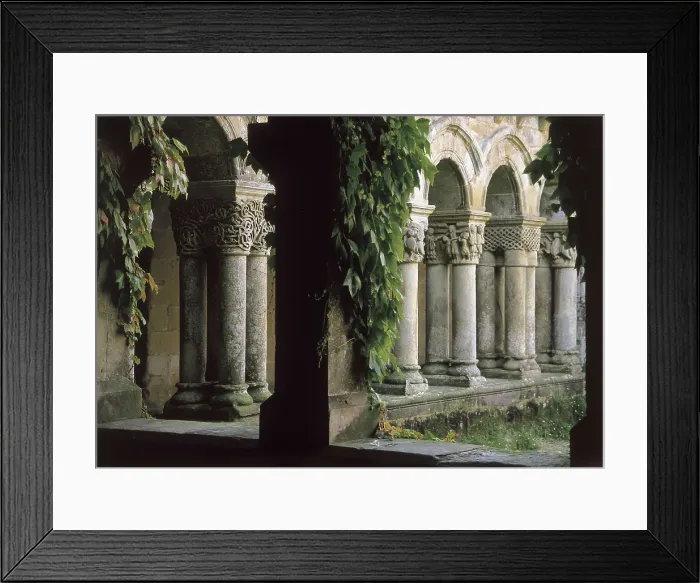 Framed Print : Collegiate church of Santa Juliana. 9th-13rd c. SPAIN. CANTABRIA. Santillana de Mar. Geminate columns of the cloister. Romanesque art. Architecture Framed Print : Collegiate church of Santa Juliana. 9th-13rd c. SPAIN. CANTABRIA. Santillana de Mar. Geminate columns of the cloister. Romanesque art. Architecture