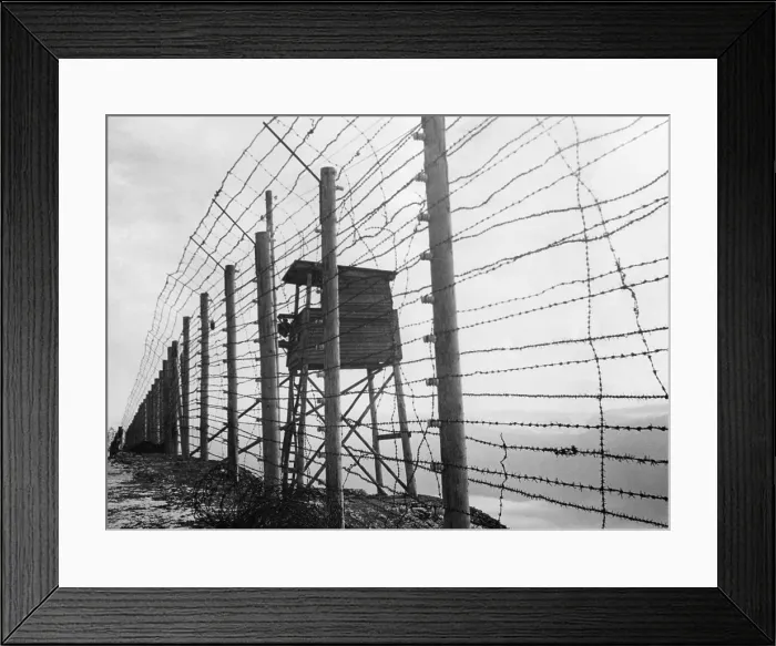 Framed Print : Electrified barbed wire fence and guard house at Struthof Concentration Camp near Natzweiler, France. The evacuated camp was discovered by the American Army, on Nov. 23, 1944 Framed Print : Electrified barbed wire fence and guard house at Struthof Concentration Camp near Natzweiler, France. The evacuated camp was discovered by the American Army, on Nov. 23, 1944