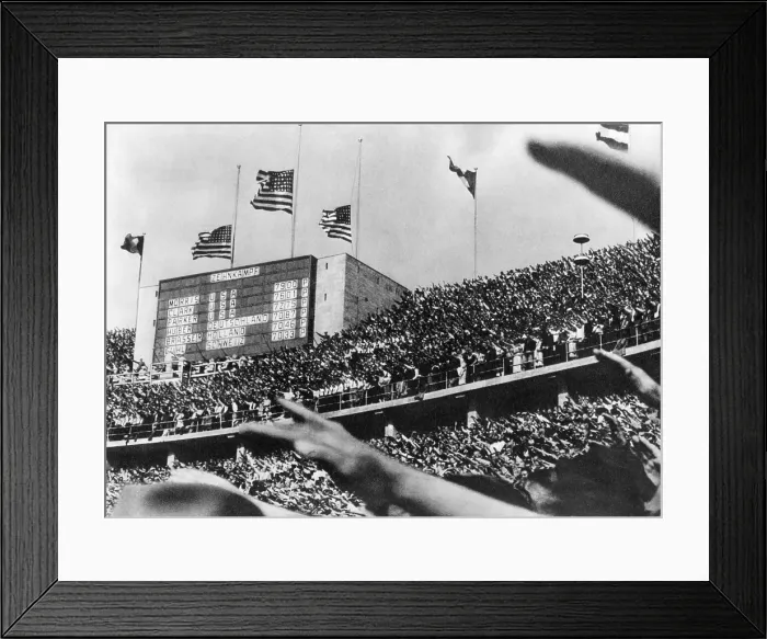 Framed Print : American flags fly over the Berlin Olympic stadium, marking the tops scores of American decathletes Framed Print : American flags fly over the Berlin Olympic stadium, marking the tops scores of American decathletes