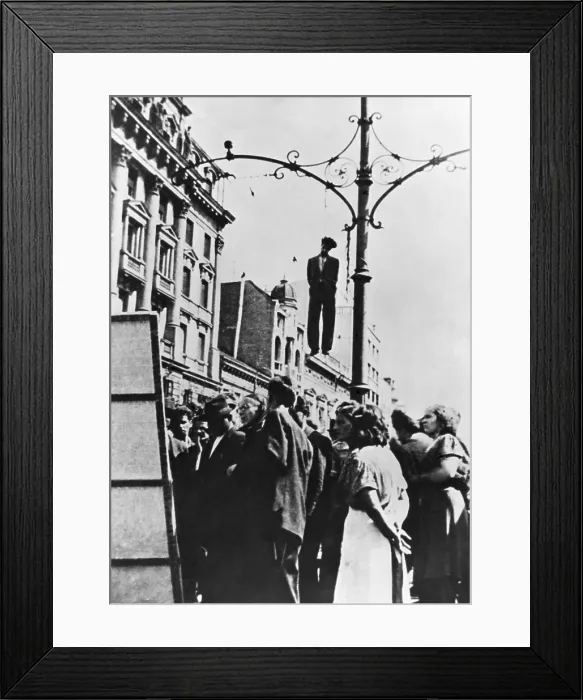 Framed Print : Yugoslavian partisan hanging from a lamp post on Milan St. in Belgrade during World War 2. Ca. 1941-44. (BSLOC_2015_13_33) Framed Print : Yugoslavian partisan hanging from a lamp post on Milan St. in Belgrade during World War 2. Ca. 1941-44. (BSLOC_2015_13_33)