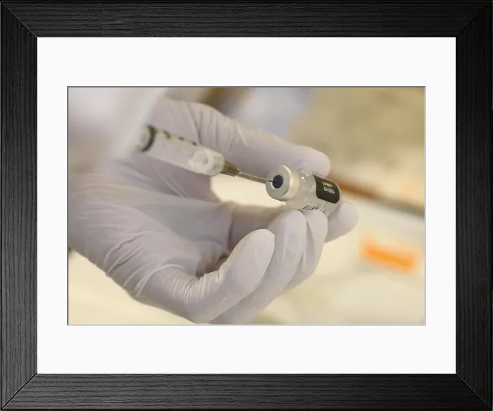 Framed Print : A technician loads a syringe with COVID-19 vaccine at Walter Reed National Military Medical Center in Bethesda, Md. Dec. 14, 2020 (BSLOC_2021_1_26) Framed Print : A technician loads a syringe with COVID-19 vaccine at Walter Reed National Military Medical Center in Bethesda, Md. Dec. 14, 2020 (BSLOC_2021_1_26)